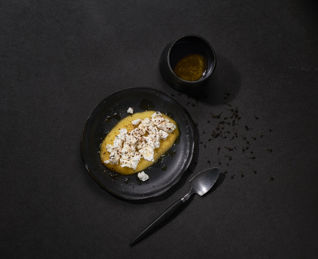 Fresh goat's cheese on a bed of mango